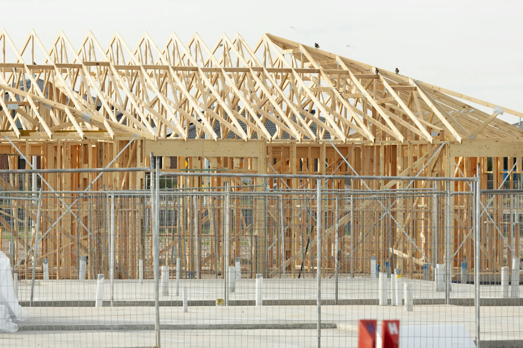 Close view of wooden roof trusses on a new house
